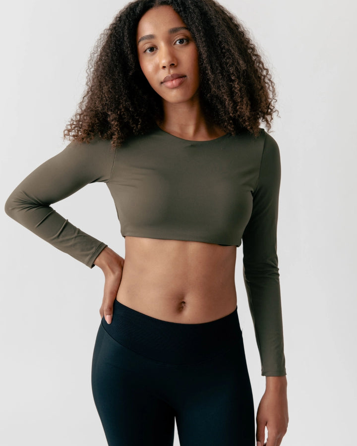 Woman wearing an Olive Green Sports Top Bra in Profile