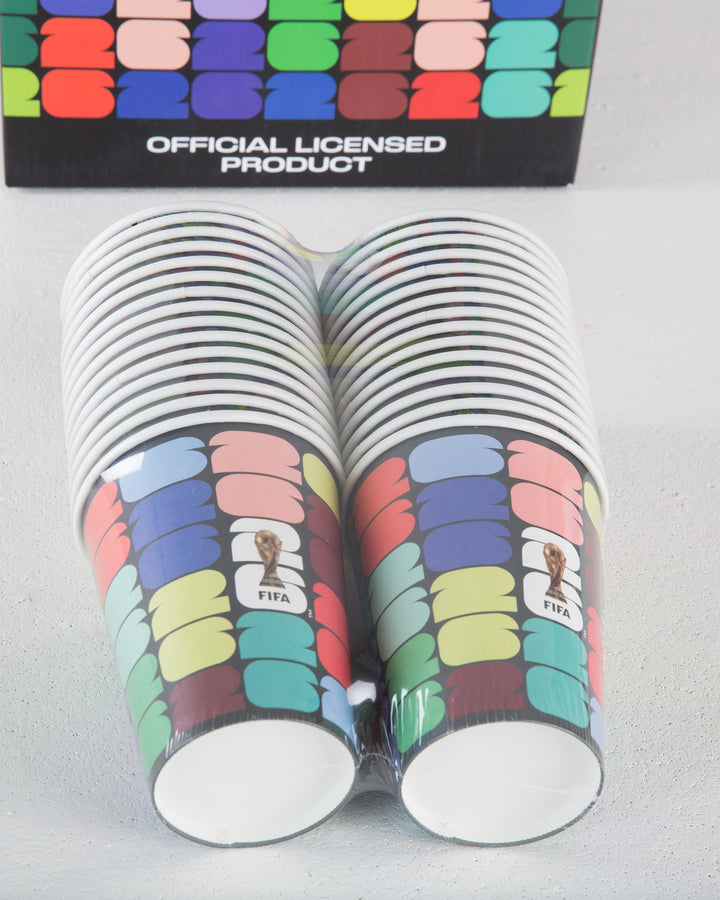 Stack of colorful paper cups with FIFA logo, next to a branded box on a gray background