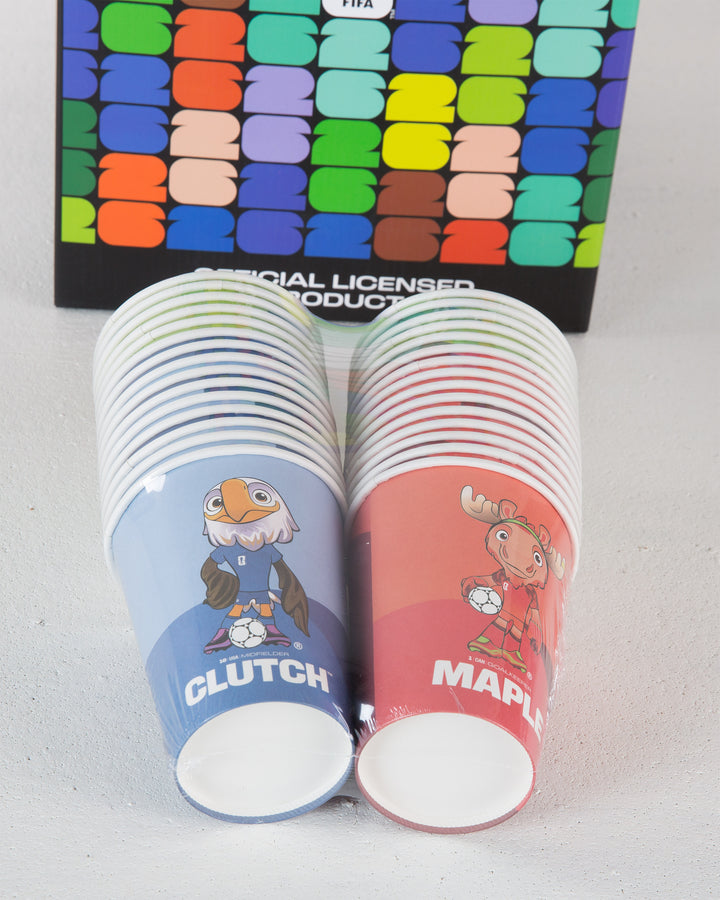 Two stacks of paper cups with cartoon characters and text, in front of a colorful patterned box.