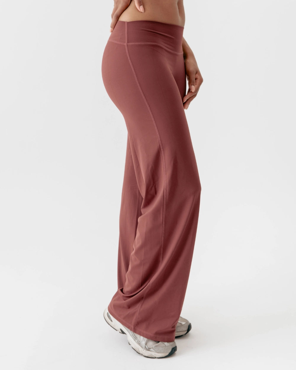 Mauve wide-leg pants worn by a person on a white background