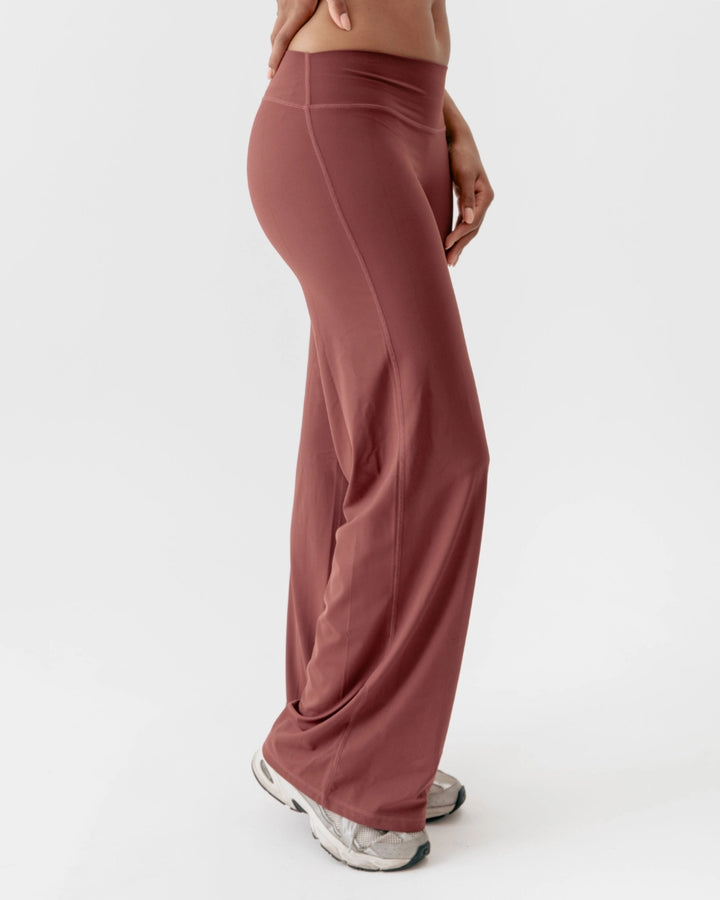 Mauve wide-leg pants worn by a person on a white background